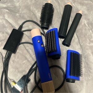 Blue Dyson airwrap with attachments and case